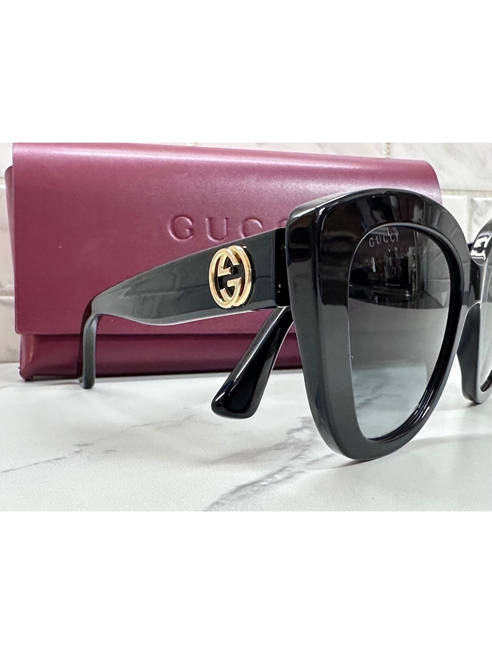 Gucci GG0327S Black Cat Eye Sunglasses with Gold Logo